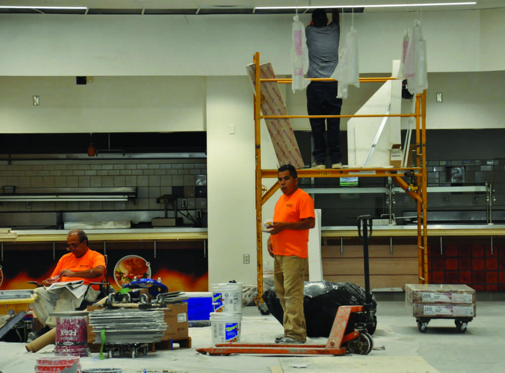 A group of construction workers and carpenters worked through their lunch on Aug. 18 in order to ensure that the former Runner Cafe is open for business after a summer full of renovations. Photo by Jarad Mann/ The Runner