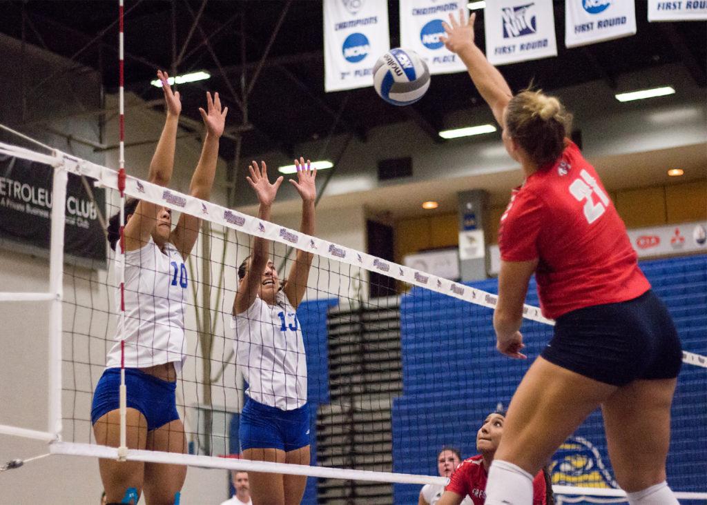 Junior outside hitter Briannah Mariner and redshirt-senior middle blocker Sydney Haynes go up to block a kill attempt against Fresno State on Sept. 12 in the Icardo Center.
Photo by Scot Swan/The Runner