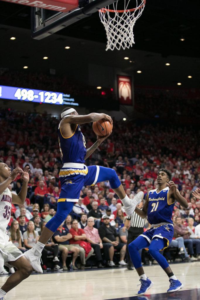 CSUB's Shon Briggs snatches an attempted alley-oop out of the air.
Photo by Simon Asher 