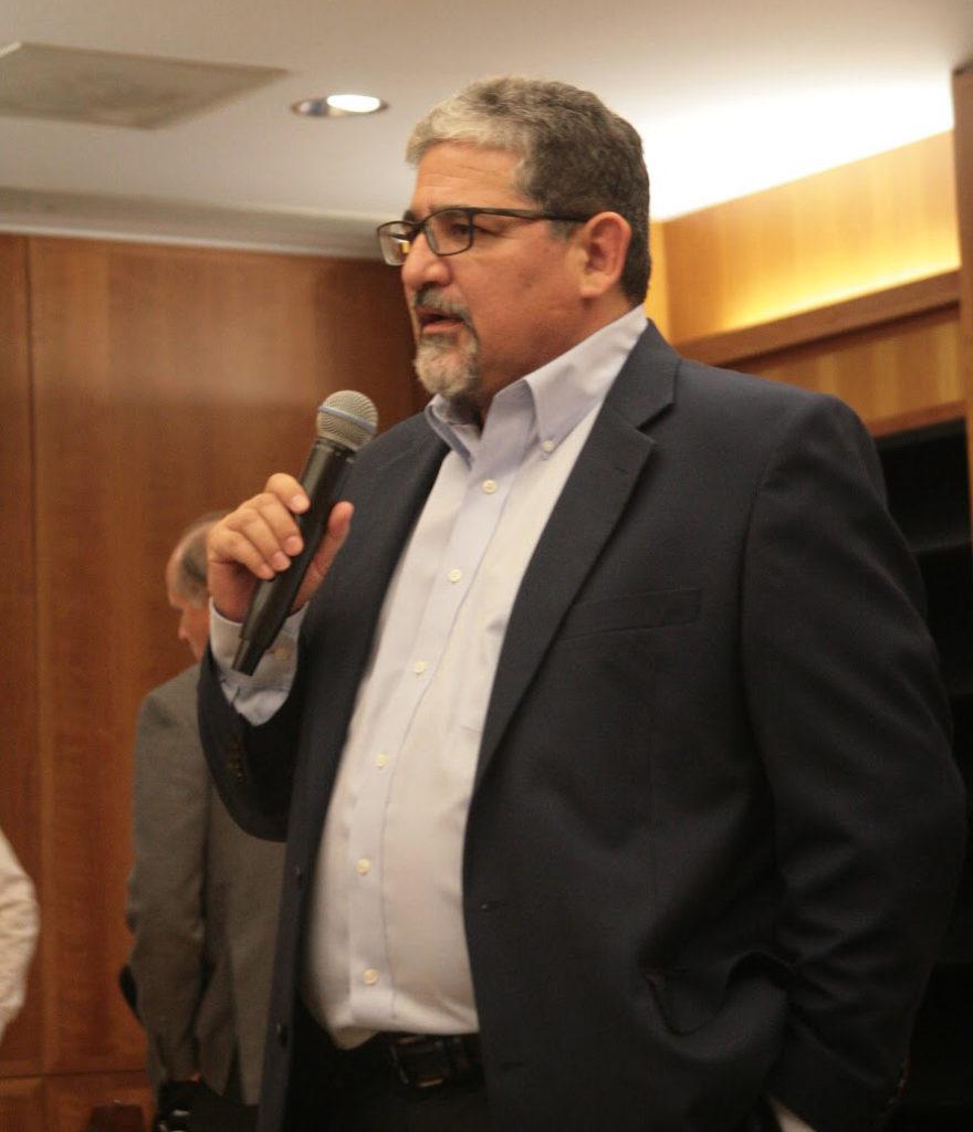 Professor Mark Martinez addressed the crowd in the Dezember reading room on Oct. 19, Martinez spoke about immigrant rights at the screening of " American Migrant Stories." 
Photo by Veronica Morley/ The Runner 
