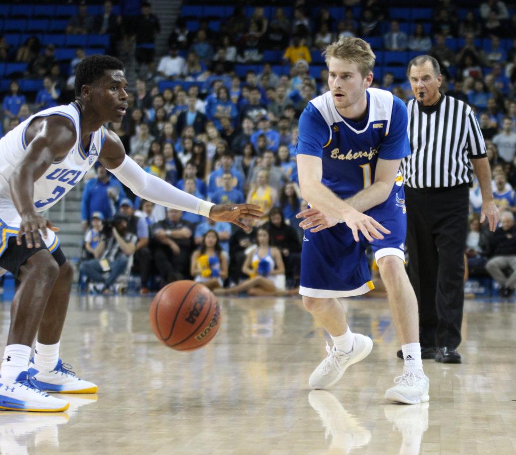 Brent Wrapp, a CSUB redshirt-senior guard, passes the ball to a teammate on Wednesday, Nov. 29 at Pauley Pavilion. CSUB lost 66-75 in their second-meeting ever.
Photo by Peter Castillo/The Runner