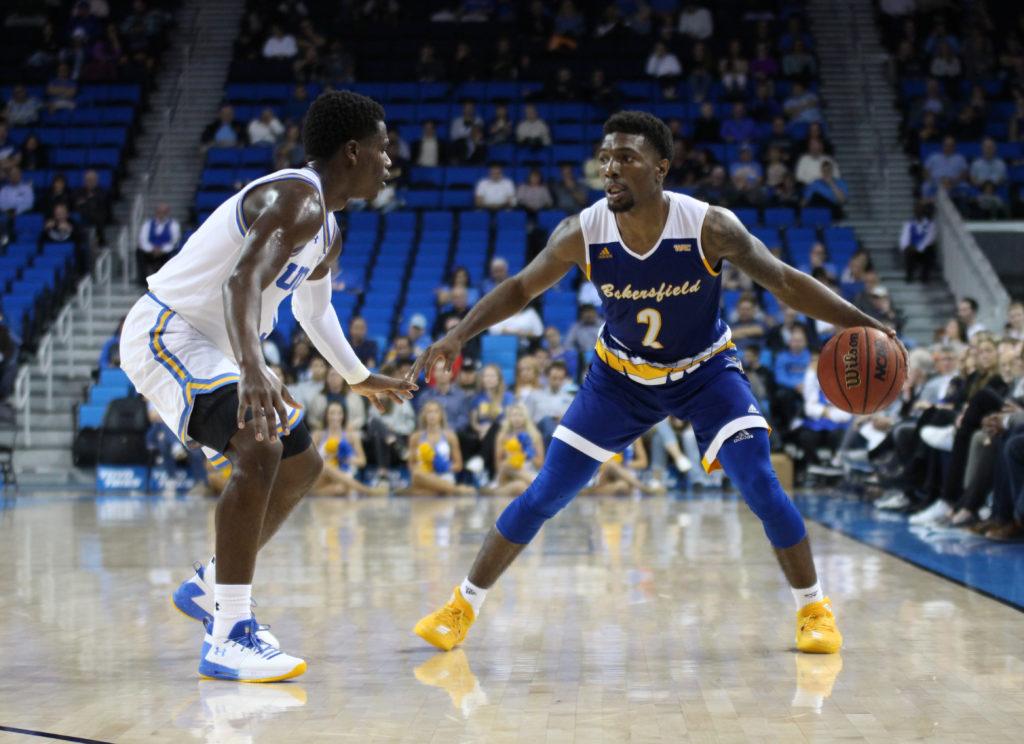 Holden surveys the floor as he is defended by UCLA junior guard Aaron Holiday.
All Photos by Peter Castillo/ The Runner