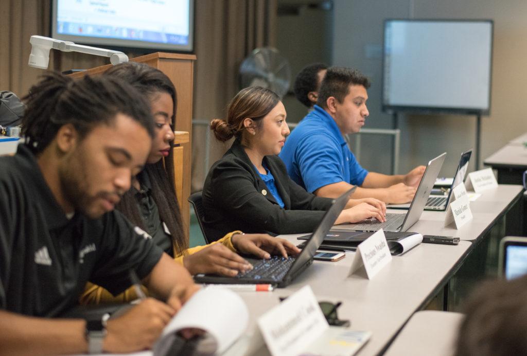 From left to right, Associated Students Inc. Executive Board members Mohammed Cook, Precious Nwaoha, Mariela Gomez, and Anthony Briseno talk about campus issues at an Oct. 13 ASI meeting. 
Photo by Simer Khurana/ The Runner 