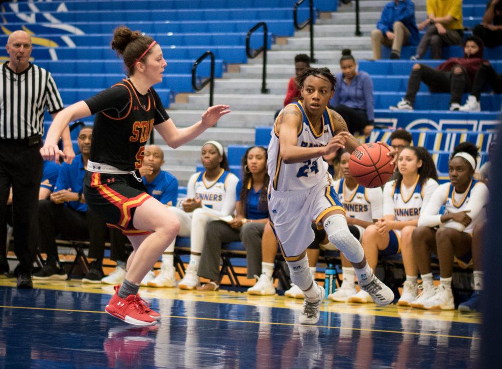 Senior forward Aja Williams drives by a Stanislaus State defender at the Icardo Center on Tuesday, Nov. 7.