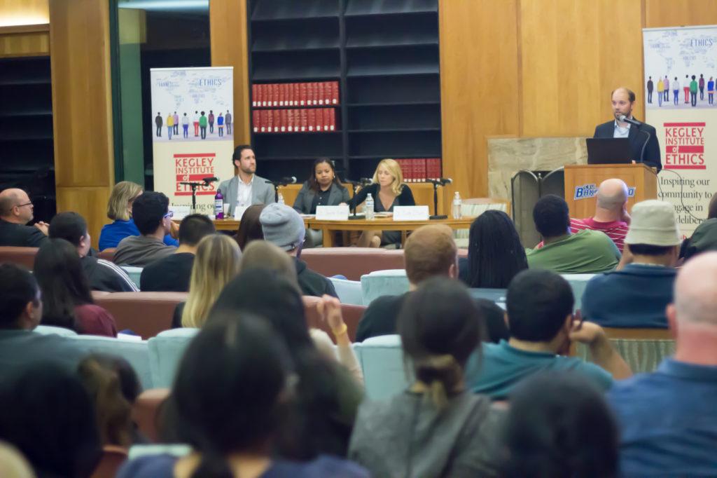Photo by Scott Swan / The Runner
Dr. Nate Olson (standing) moderates the discussion on Free Speech. Panelists from left to right are Dr. Michael Burroughs, Dr. Ivy Cargile, & Dr. Jeanine Kraybill.
