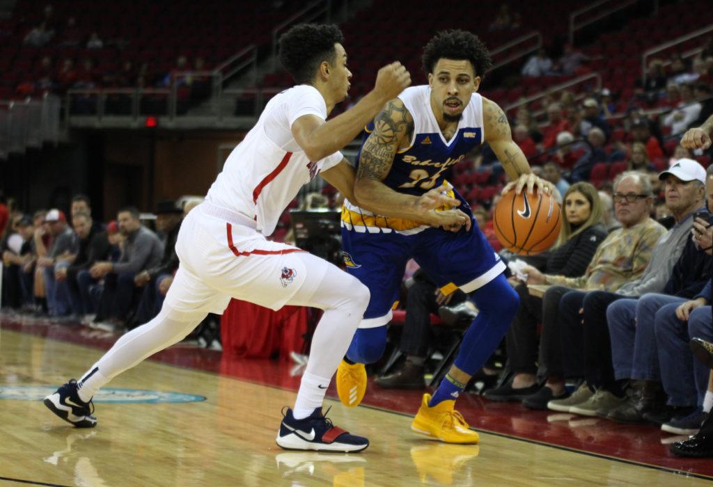 Redshirt-senior guard Damiyne Durham drives along the sideline against a  Fresno State defender at the Save Mart Center during a game last season.
Peter Castillo/ The Runner