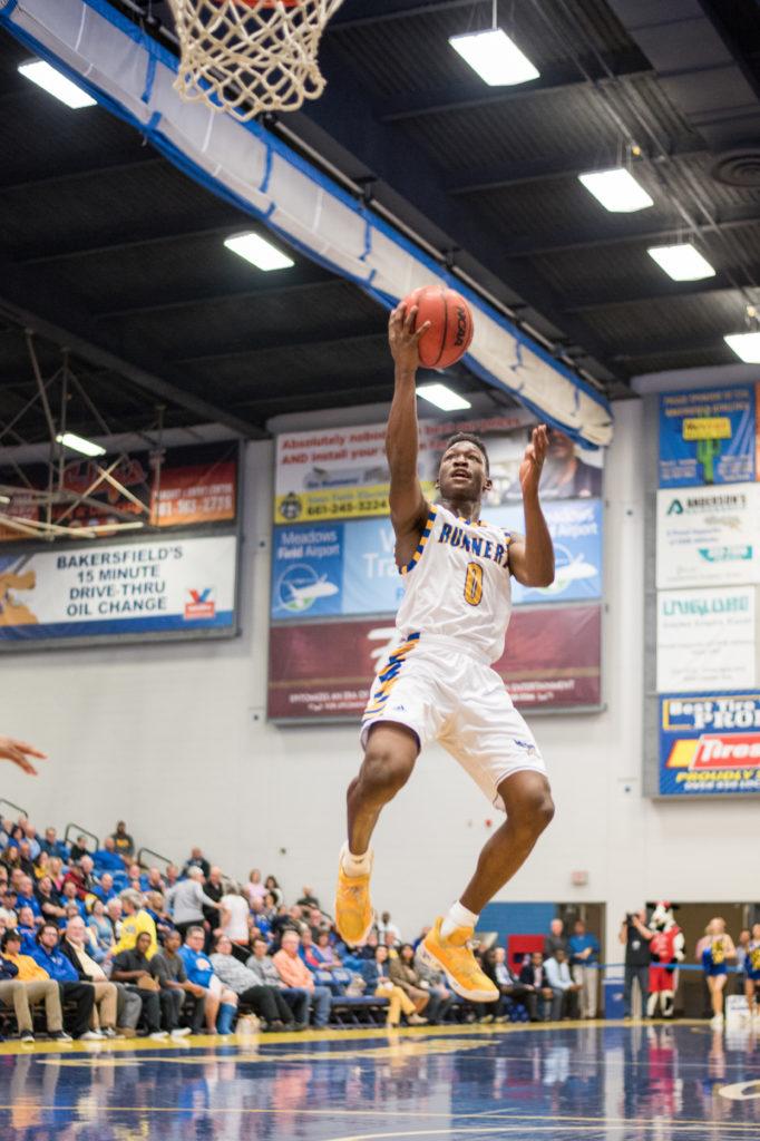 Freshman guard Jarkel Joiner rises for a breakaway layup in a game against Chicago State on Feb. 1 at the Icardo Center.
Photo by Simer Khurana/ The Runner