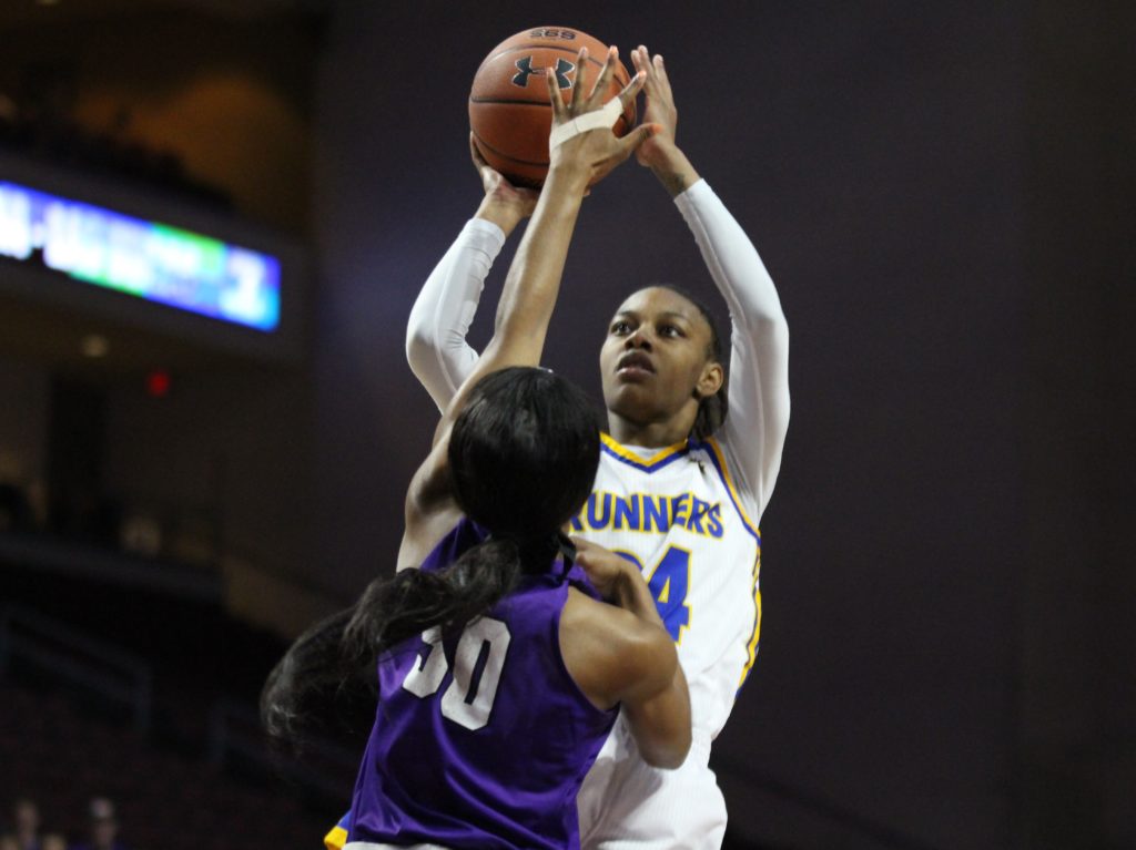 Senior forward Aja Williams rises for a jump shot over Myra Willaims of Grand Canyon in the WAC tournament semifinals on Friday, March 9 at the Orleans Arena in Las Vegas. Photo: Vincent Perez