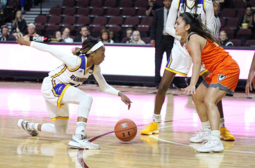 Redshirt-junior guard Jazmine Johnson shows off her handles in front of a UTRGV defender in a Western Athletic Conference quarterfinals game at the Orleans Arena on Wednesday, March 7.