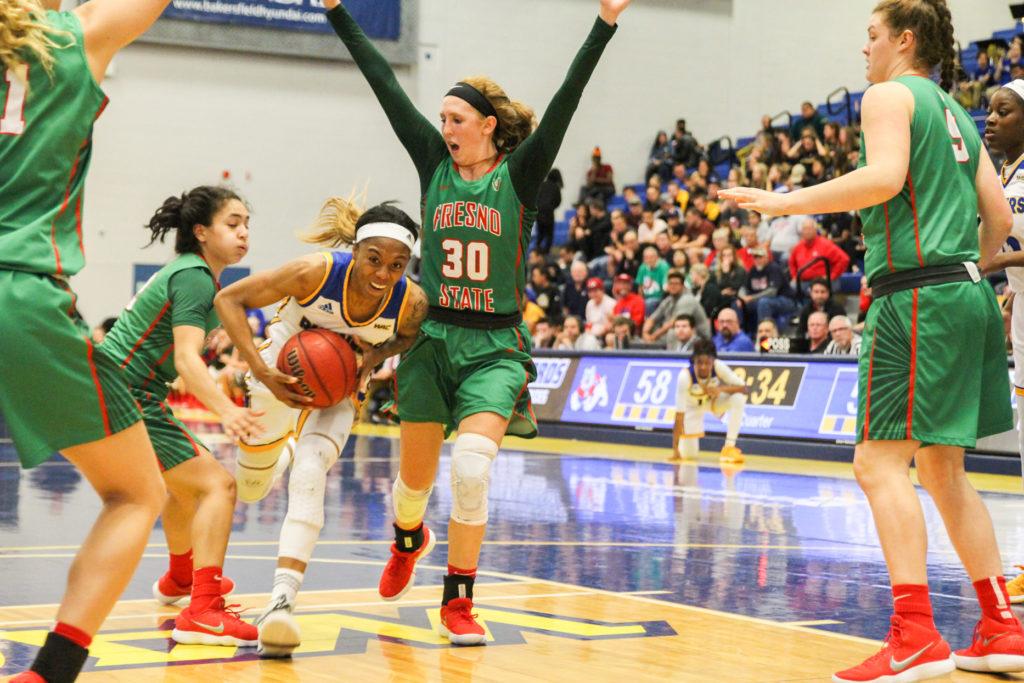 Senior JJ Johnson drives through the lane past four Fresno State defenders during the WBI Tournament on Wednesday, March 14, 2018 in the Icardo Center.