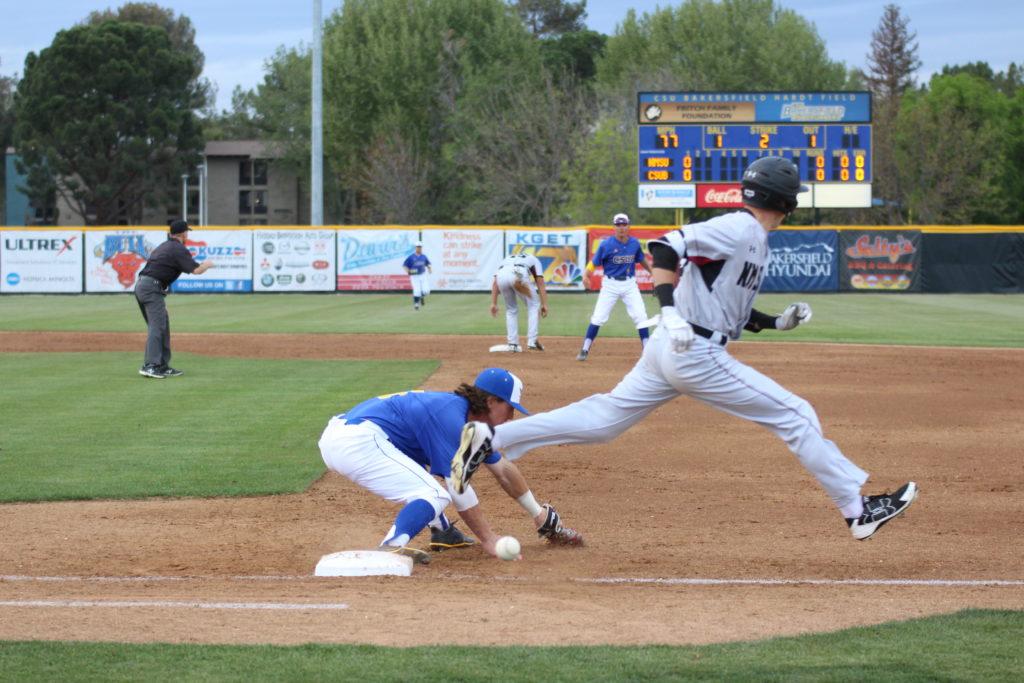 CSUB freshman shortstop overthrows  senior first baseman Andrew Penner  in the second inning, Friday, April 6 at Hardt Field.

Photo by Ricky Gonzales/ The Runner