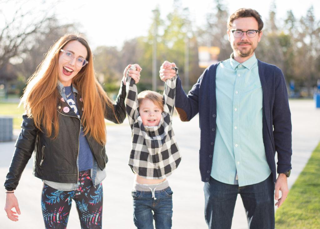 Photo by Simer Khurana/The Runner
Professor Kathleen Hanson and her husband Nick Harl swing their son Finnegan at CSUB on March 23, 2018. 