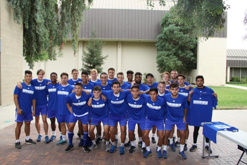 Men's soccer high fives a common goal