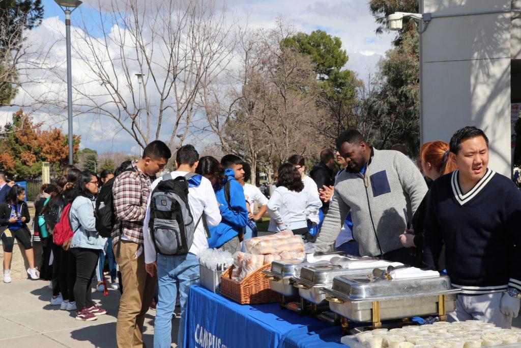 CSU Bakersfield students gather in front of the Student Union building on Monday, Feb. 18 to receive food at the kickoff BBQ for homecoming week.

Sergio Hernandez/The Runner