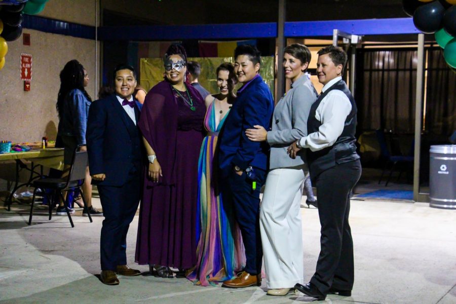 From left to right, Bobbi and BreAnna Evans-Santiago, Michaela Donohue-Kim, P.K., Sarah Downie, and Kris Grappendorf arrive for a lovely evening at the MasQUEERade Ball in the Stockdale Room on Friday, March 29. Leo Garcia/The Runner