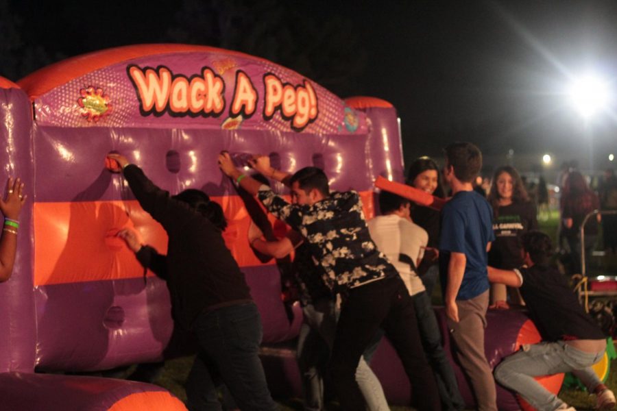 CSUB students participate in an intense game of “Whack a Peg” during the Fifth Annual Runners Night Carnival. 
