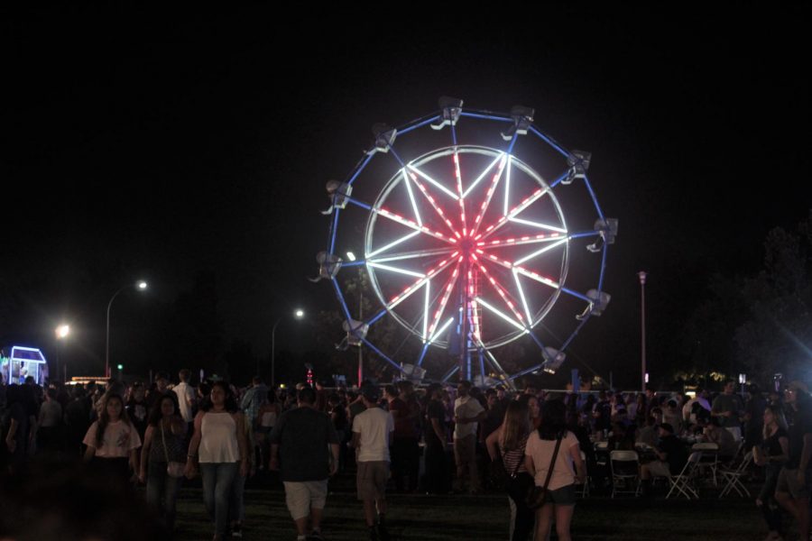 Midnight on Sept. 13, a large group of CSUB students socialize with one another during the Fifth Annual Runners Night Carnival. 