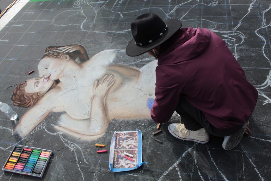 Ramiro Hernandez, a junior studio arts major at CSUB works on his piece on Day 1 of Via Arté at the Market Place. 