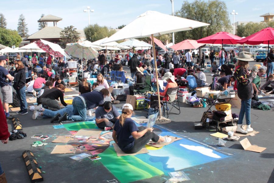 Local artists work on their art during Day 1  of Via Arté at the Market Place.