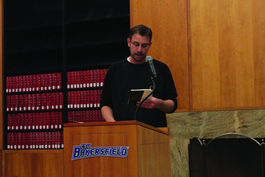 Poet Lindsay Wilson reciting a poem on October 14 in the Dezember room in the Walter W. Stiern Library part of the California Writers Series.