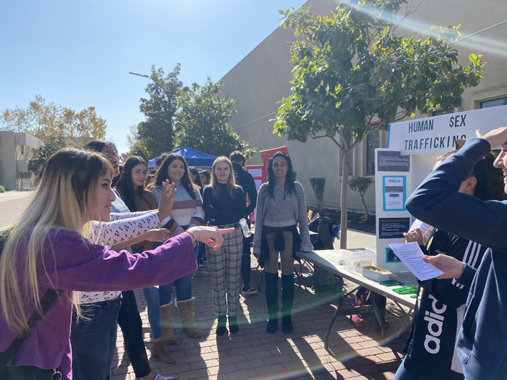 A group of students gather around to talk about sex trafficking, how they can potentially prevent it, and what to look out for. 