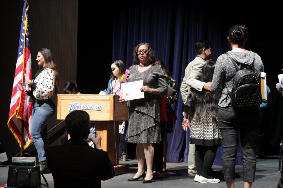 Newly naturalized valley residents pose for photographs after the Naturalization Ceremony on Nov. 12, 2019 inside Dore Theatre. 