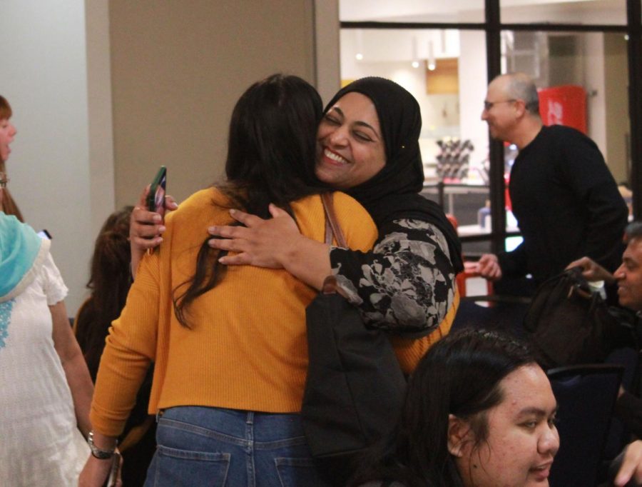 Guest speaker Fauzia Shah hugs CSUB student Nakiai Kiai after the Women, Religion, and Empowerment panel discussion on Thursday Nov. 21.