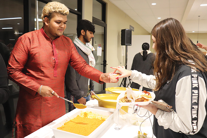 International student from India, Divyang Motavar, was serving Indian food for CSUB students at Runner Café on Nov. 20, 2019.