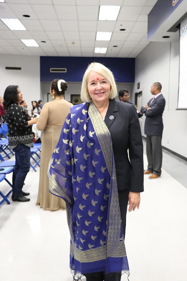 President Zelezny posed for a picture with her blue dupatta that was presented to her by Lisa Zuzarte on Oct. 29, 2019 during the ASFN Diwali Celebration. A blue dupatta is traditionally worn and has gold "Deeveh" (Diwali lamps) on the border. The blue and gold stand for CSUB colors and the lamps stand for Diwali. 