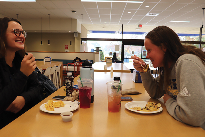Students eating in the Runner Cafe during the Fall 2019 semester. Runner Cafe is one of many dining options available on campus.