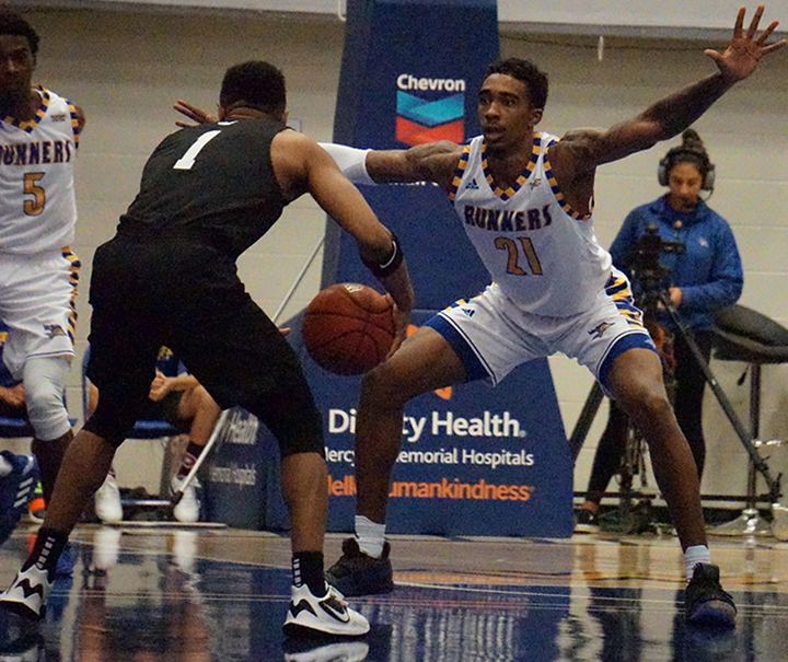 Junior Forward Greg Lee provides defense against Grand Canyon during basketball game Sat. Jan. 4 at Icardo Center