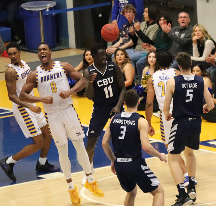 Ronne Readus and Greg Lee celebrate basket during basketball game against Cal Baptist on Wednesday Jan. 8 at the Icardo Center
