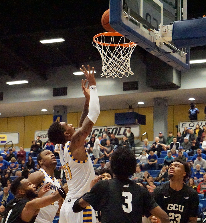 Junior Forward Greg Lee goes for a two pointer basket against Grand Canyon during basketball game Sat. Jan. 4 at Icardo Center