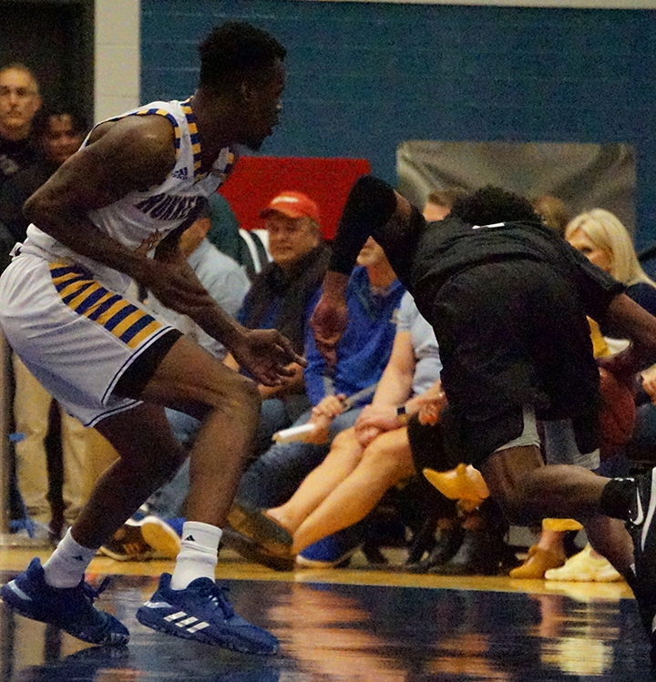 Junior forward Taze Moore gets in front of Grand Canyon player to block during basketball game Sat. Jan. 4 at Icardo Center
