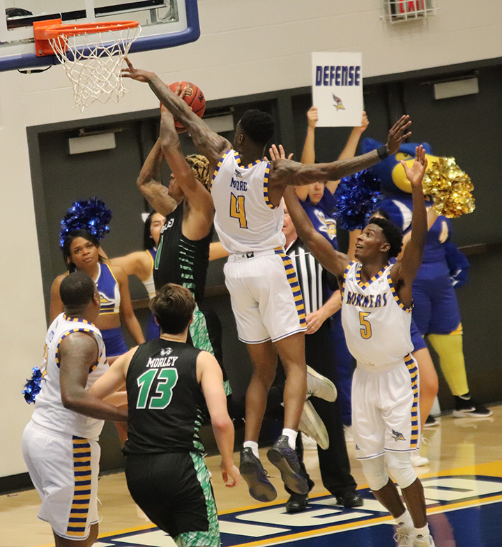 Junior Taze Moore goes from the block 
