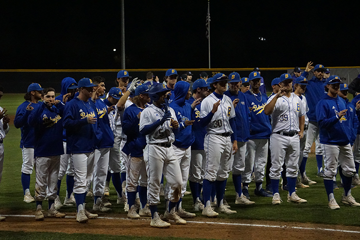 The baseball team sings the alma mater song after the series against Holy Cross at Hardt Field