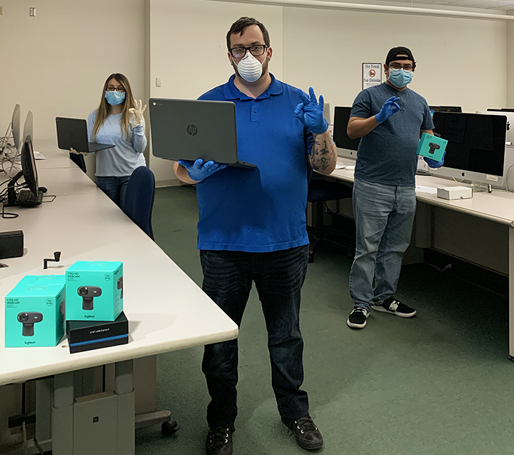 Pictured: IT Assistant Maira Mendez, Service Center Supervisor Bryan Ellison, and IT Assistant Abraham Chipres in Lab A of the Walter Stiern Library. 