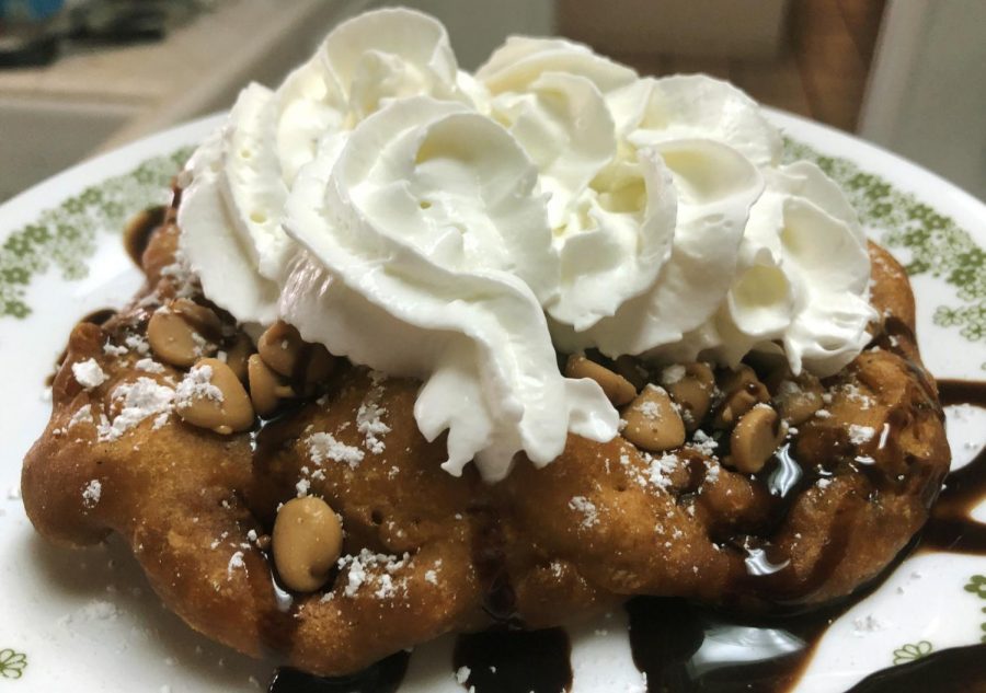 Top the funnel cakes with powdered sugar and other fun toppings for a tasty treat!