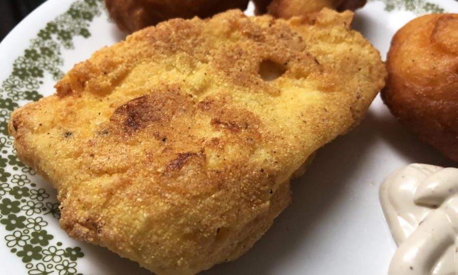 The fish should be a light golden brown when it is ready.