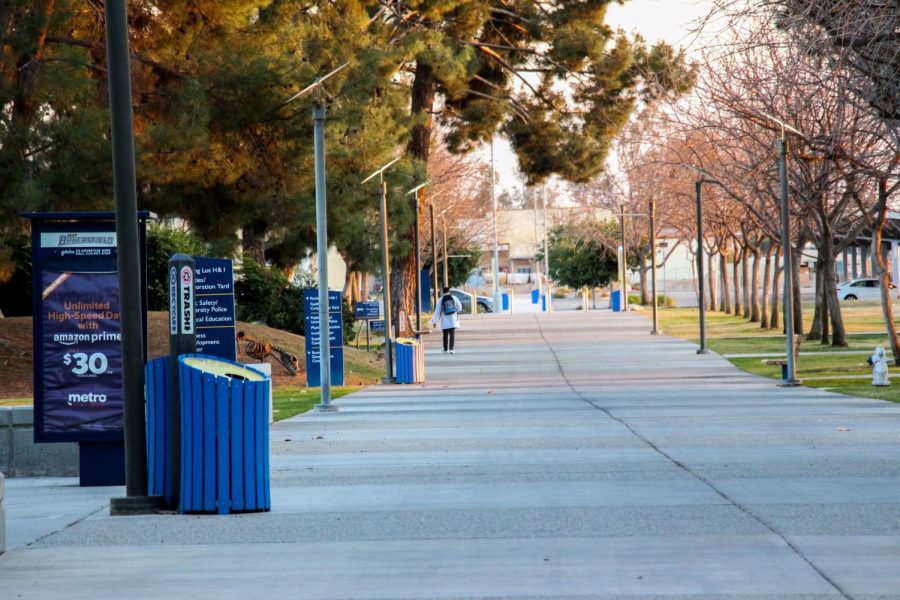 A student walks by the Student Health Center on the way to parking lot on the south side of campus on March 10, 2021