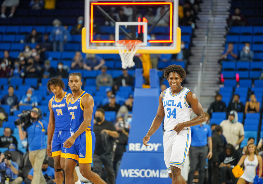 From left to right: CSUB's Ray Somerville, Ivan Reynolds and UCLA's David Singleton exit the court as the buzzer finalizes the Bruins 95-58 victory.