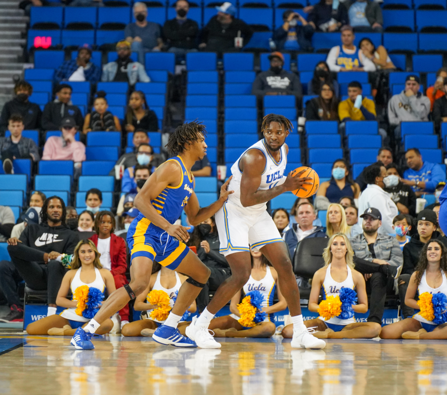 UCLA forward Kenneth
Nwuba posts up against CSUB's Ray Somerville's defense. Nwuba finished the game with 4 points, 2 rebounds, and 2 blocks.