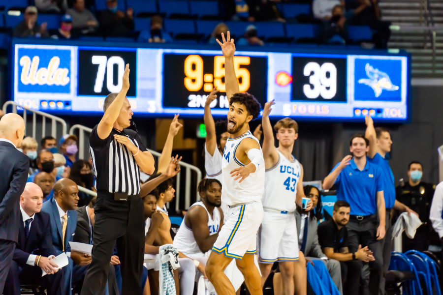 UCLA guard Johnny Juzang celebrates after knocking down an open 3-point field goal. Juzang finished the game with 19 points, 4 rebounds, and 1 assist. 