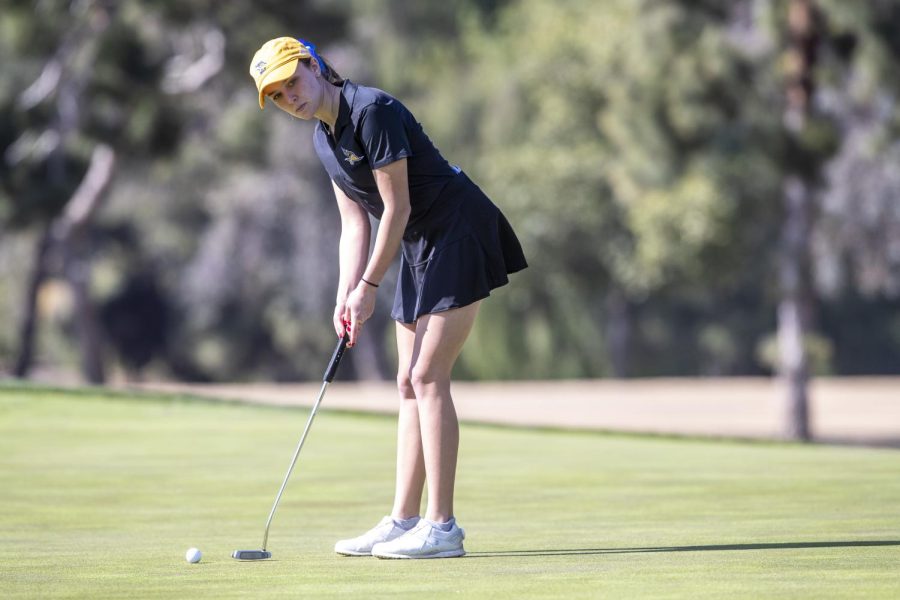 Jefi Dordevic playing golf.