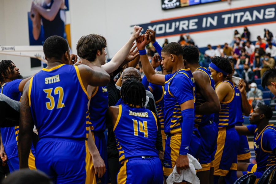 Members of the CSUB Men's Basketball team huddle up during a game against Cal State Fullerton on Feb. 5, 2022, in Fullerton, California.
