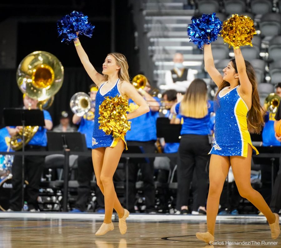 Left to right: Myah Salinas and Lupita Reyes. The CSUB Dance team, Cheer team, and Pep Band gave the 'Runners a unique home-court advantage in the out-of-state Big West Championship's opening game.
