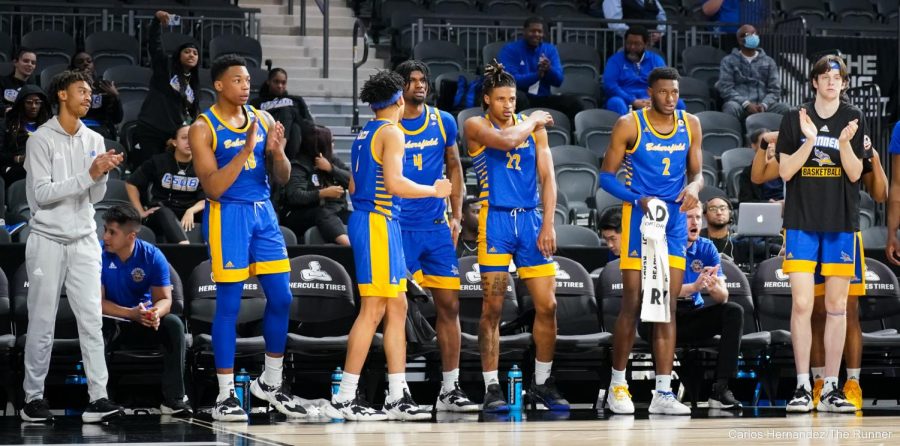 The 'Runners bench looks on as the team attempts to hold the lead with minutes left.
