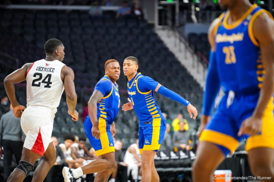 Shawn Stith celebrates after converting another field goal in the paint. Stith tied for a team high 15 points.
