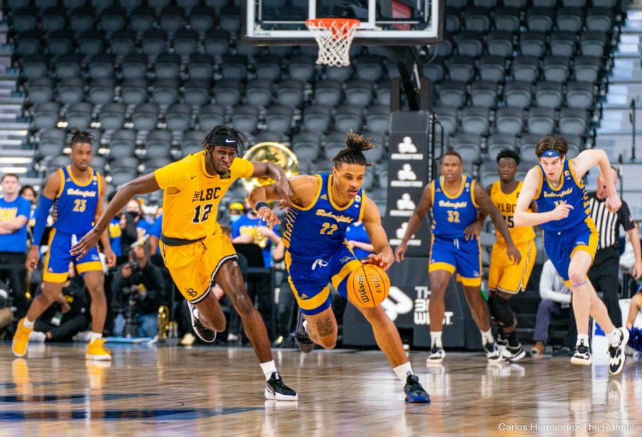 Justin McCall steals the ball at the onset of CSUB's second game of the Big West Championship.
