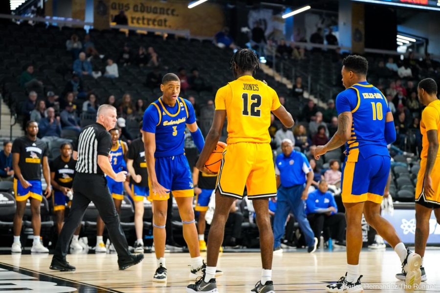 CSUB's Cameron Smith converts the field goal and signals to LBSU's Jadon Jones that he is too small to guard him.
